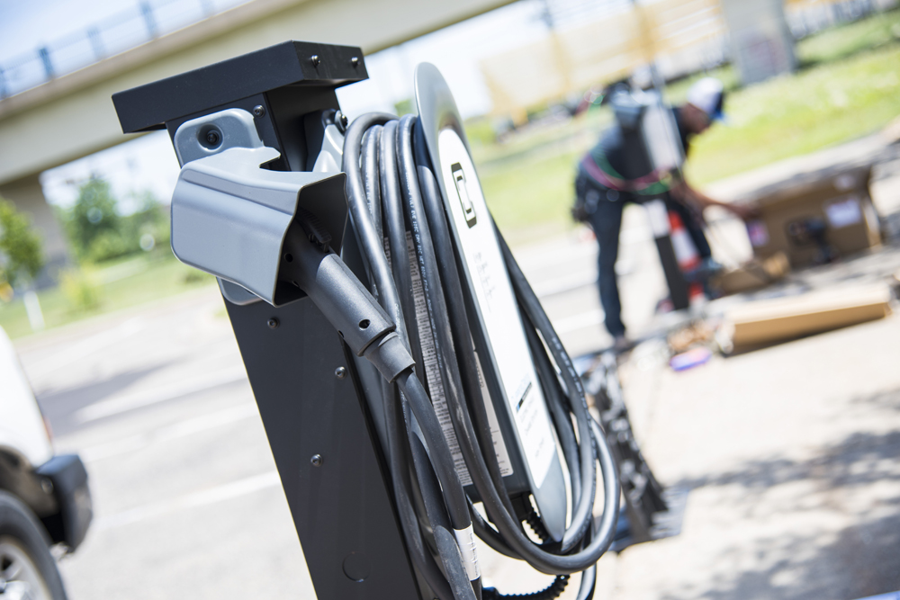 A level 2 electric vehicle charger being installed outside Great Plains Institute offices in Minneapolis, MN